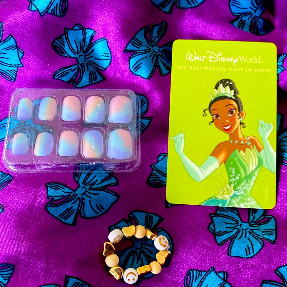 I am selling a Disney card and a hand made bracelet and a stick on nails.